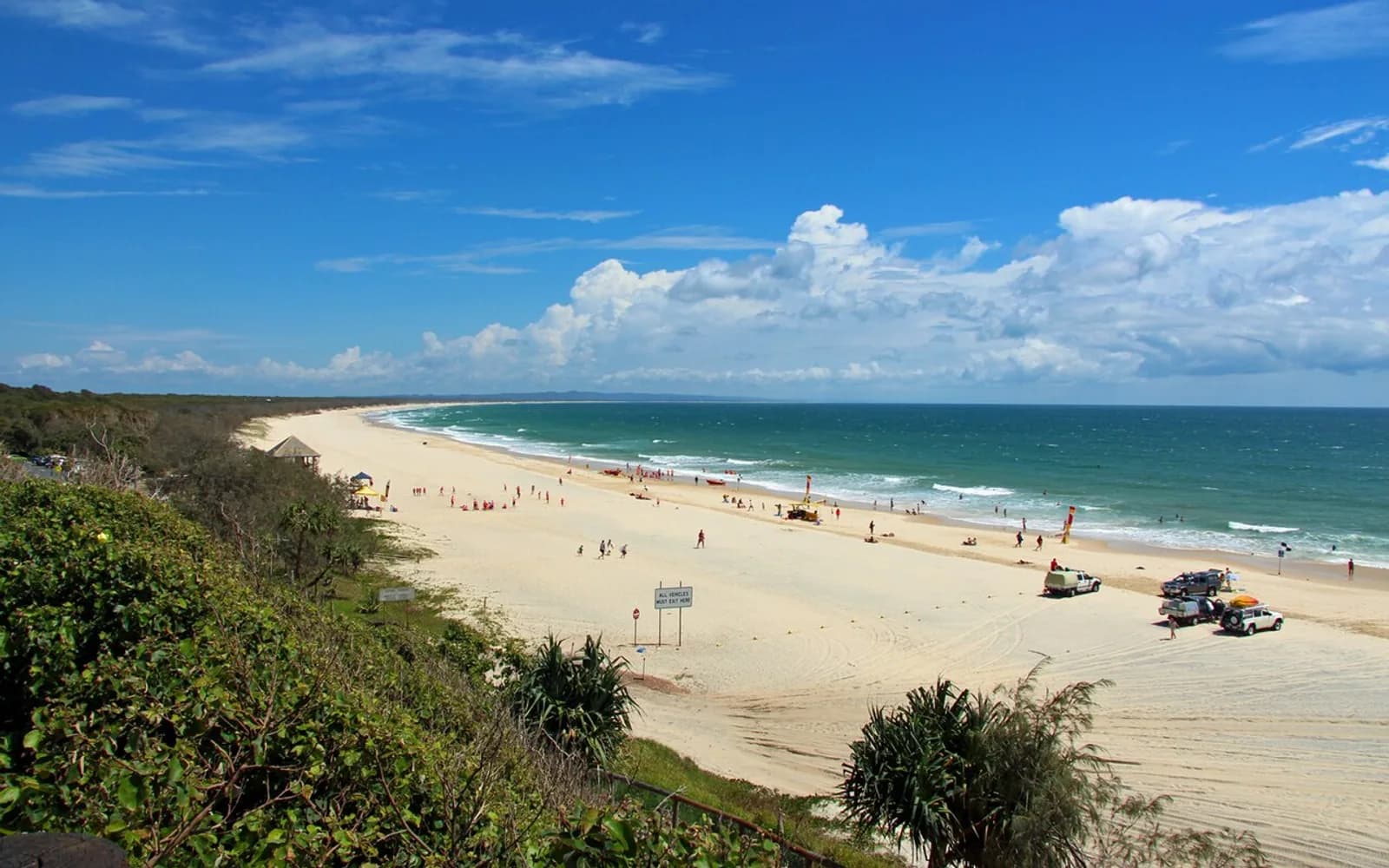 Wide sandy beach and blue ocean at Rainbow Beach